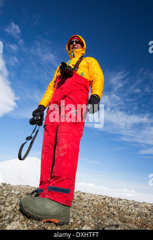 A man from an expedition cruise on Joinville Island just off the Antarctic Peninsular. Stock Photo