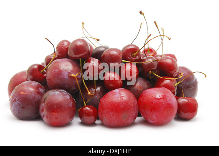 plums and cherry isolated on white Stock Photo