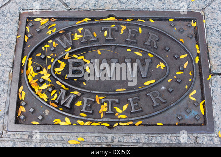 Manhole cover (BWW - Water Meter) in the streets of Boston, Massachusetts, USA Stock Photo