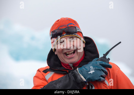 A leader on an expedition cruise to Antarctica off Cuverville Island, Antarctic Peninsular. Stock Photo