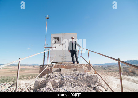 businessman in front of office container Stock Photo
