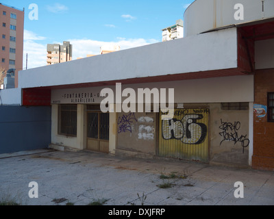 Closed down shops in Benidorm Spain covered in graffiti Stock