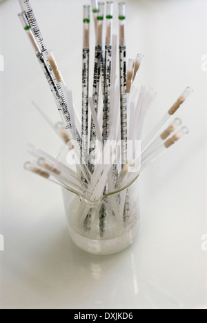 Test-tubes on color background Stock Photo - Alamy