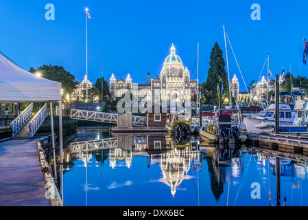 Parliament Buildings and harbor illuminated at dawn, Victoria, British Columbia, Canada Stock Photo