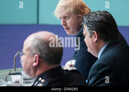 London, March 27th 2014. Boris Johnson, top, Deputy Mayor for Crime and Policing Stephen Greenlagh, right, and Met Police Deputy Commissioner Craig Mackey as the Police and Crime Committee of the London Assembly questions them on undercover policing and the governance of the Metropolitan Police. Credit:  Paul Davey/Alamy Live News Stock Photo