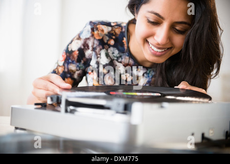 Close up of Asian woman using record player Stock Photo