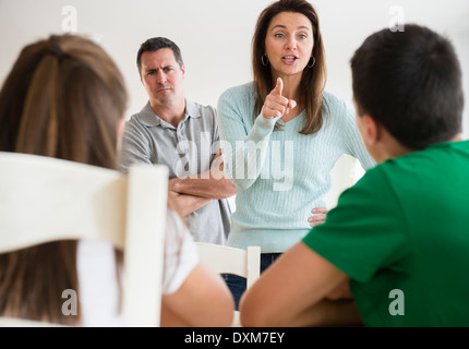 Caucasian parents scolding children Stock Photo