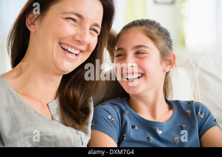 Close up of Caucasian mother and daughter laughing Stock Photo
