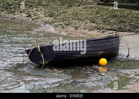 A wood   en clinker built rowing boat used for fly fishing on 