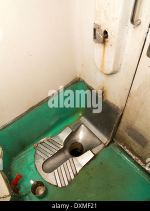 India, Rail Travel, 2nd class 2 tier air conditioned 2A carriage toilet interior, squat lavatory Stock Photo