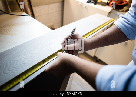 close up of hands with meters taking measures bricolage home Stock Photo
