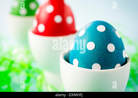 Dotted Eastern eggs,selective focus on the front blue egg. Stock Photo