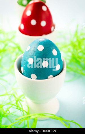 Selective focus on the front dotted blue Easter egg Stock Photo