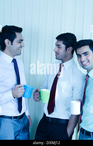 Indian BusinessMen Drinking Tea and talking Stock Photo