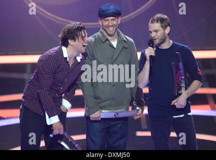 Berlin, Germany. 27th Mar, 2014. Peter Brugger (R), Florian Weber (C) and Ruediger Linhof from the band Sportfreunde Stiller celebrate receiving the Echo in the category 'Rock/Alternative National' during the Echo Music Awards in Berlin, Germany, 27 March 2014. It is the 23rd Echo Music Awards for outstanding achievement in the music industry. Photo: BRITTA PEDERSEN/dpa/Alamy Live News Stock Photo