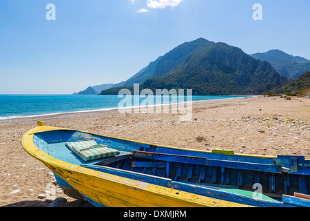 Beach in the quiet resort of Cirali looking towards the ruins at Olympos, Kemer District, Antalya Province, Turkey Stock Photo