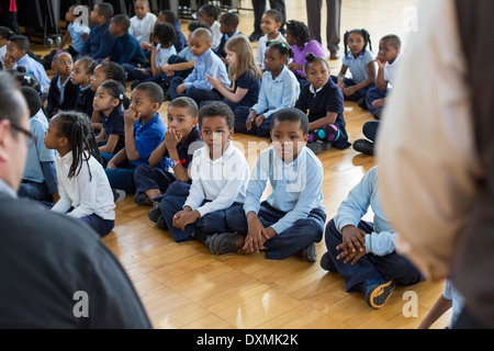 Kindergarten and first grade students at Chrysler Elementary School listen as a children's book is read. Stock Photo