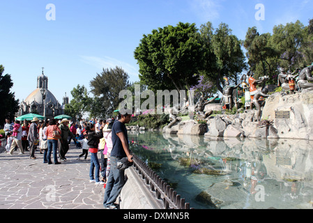 People by the pond and statues on Tepeyac Hill, Basilica de Guadalupe, Mexico City, Mexico Stock Photo