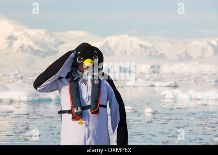 Crew members of an expedition cruise to Antarctica in a Zodiak in Fournier Bay in the Gerlache Strait on the Antarctic Peninsula Stock Photo