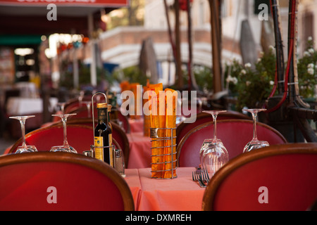 Restaurant table setup for business, along canal in Venice, Italy. Stock Photo