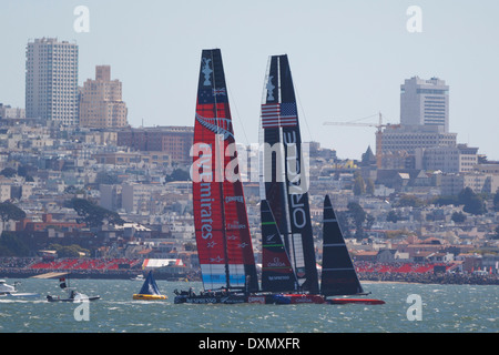 Oracle Team USA skippered by James Spithill and Emirates Team New Zealand skippered by Dean Barker sails in the San Francisco Bay during the 2013 America's Cup Finals San Francisco, California. Stock Photo