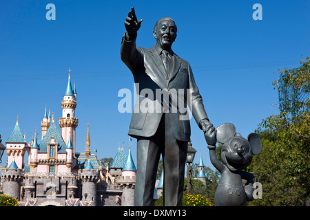 Detailed view of the Partners statue of Walt Disney and Mickey Mouse with Sleeping Beauty Castle in the background, Disneyland, Stock Photo