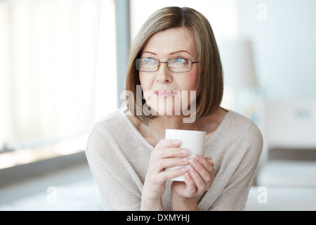 Portrait of calm mature woman with cup Stock Photo