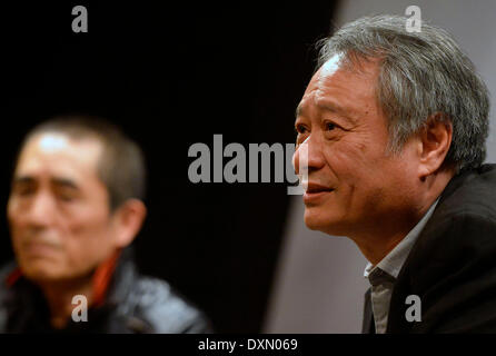 New York, USA. 27th Mar, 2014. Two-time Oscar-winning director Ang Lee (R) and renowned film director Zhang Yimou attend a dialog in New York, the United States, March 27, 2014. The two film directors on Thursday held a dialog about Chinese film culture and Zhang's new movie 'Coming Home'. Credit:  Wang Lei/Xinhua/Alamy Live News Stock Photo