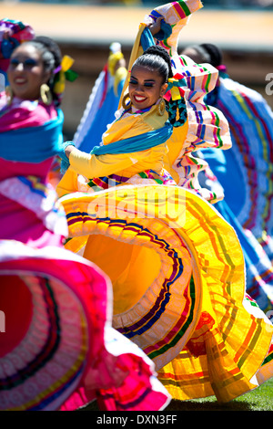 A group of Mexican folk dancers performs a traditional dance Stock Photo