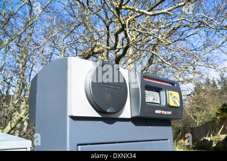 dh Electric Car park ELECTRICITY UK Scotland Electric car power point parking bay connector charging facility recharge ev vehicle plug charge Stock Photo