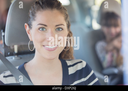 Portrait of smiling woman inside car Stock Photo