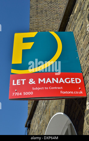 Foxtons Let and Managed estate agent sign outside a house, Islington, London, UK. Stock Photo