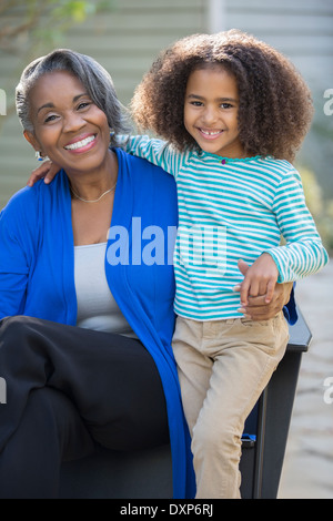 Portrait of happy grandmother and granddaughter outdoors Stock Photo
