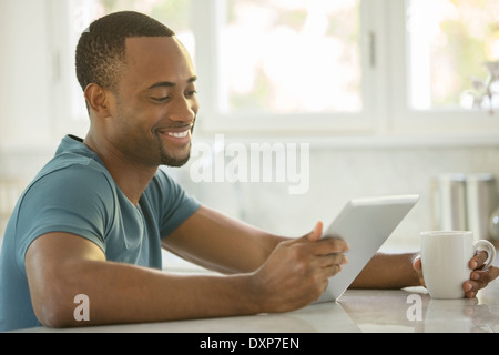 Smiling man drinking coffee and drinking coffee Stock Photo