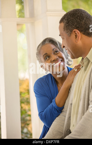 Happy senior couple hugging outdoors Stock Photo