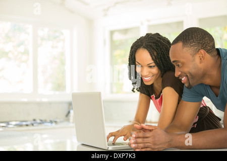 Couple using laptop Stock Photo