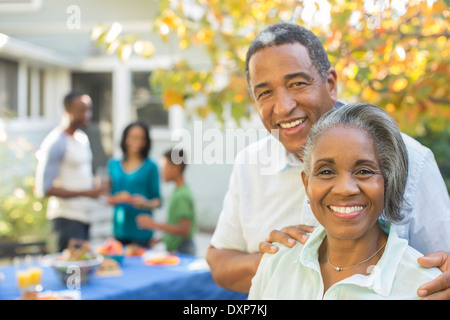 Portrait of smiling senior couple at barbecue Stock Photo