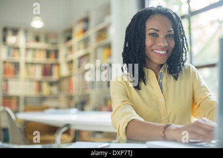 Portrait of smiling businesswoman at laptop Stock Photo