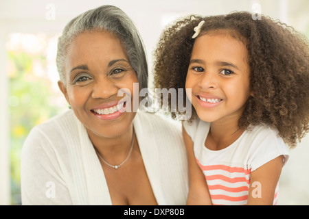 Close up portrait of smiling grandmother and granddaughter Stock Photo