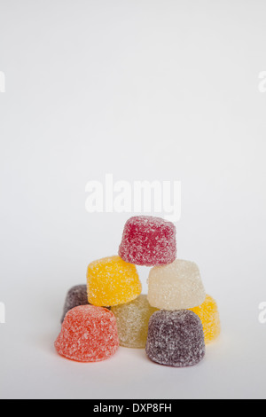 A pile of colourful American hard gums on a white background, with copy space above. Stock Photo