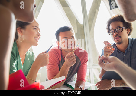 Creative business people brainstorming in circle Stock Photo