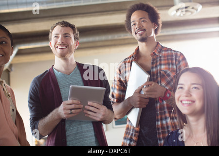 Casual business people smiling in meeting Stock Photo