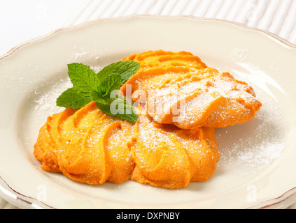 Spritz butter cookies on plate Stock Photo