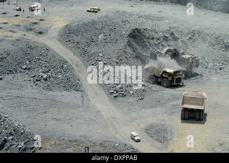 TANZANIA, town Geita, gold mining industry, open-cast goldmine of company AngloGold Ashanti , large caterpillar CAT dumper transport ore - goldmines goldmining goldminer Stock Photo