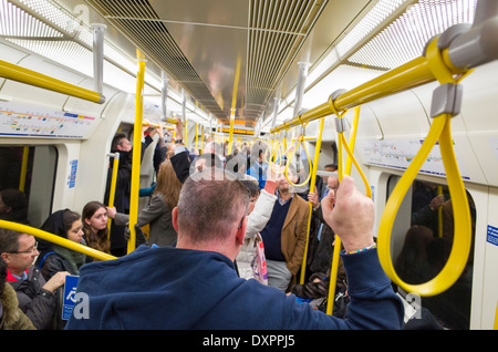 Passengers on Circle Line carriage of London Underground train, England, UK Stock Photo