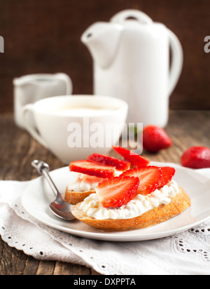 Fresh bread with Cottage cheese, strawberry and honey. Stock Photo