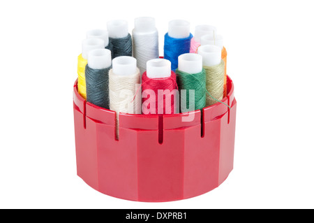 Colored spools of threads in a box isolated on white background Stock Photo