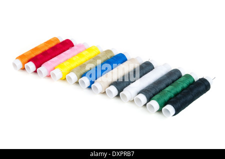 Colored spools of threads in a row isolated on white background Stock Photo