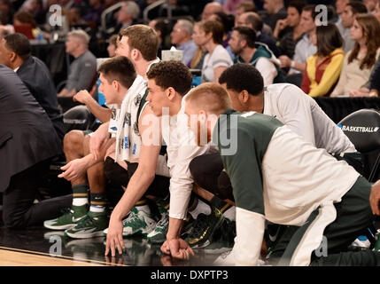 New York City, NY, USA. 29th Mar, 2014. Saturday March 29, 2014: Michigan players looks on from the sidelines during the 2nd half of the NCAA tournament eastern regional semi-final basketball game between Michigan State vs Virginia at Madison Square Garden in New York City, NY. Michigan State won over Virginia 61-59. Bill Shettle/Cal Sport Media. Credit:  csm/Alamy Live News Stock Photo