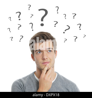 pensive young man with question marks Stock Photo